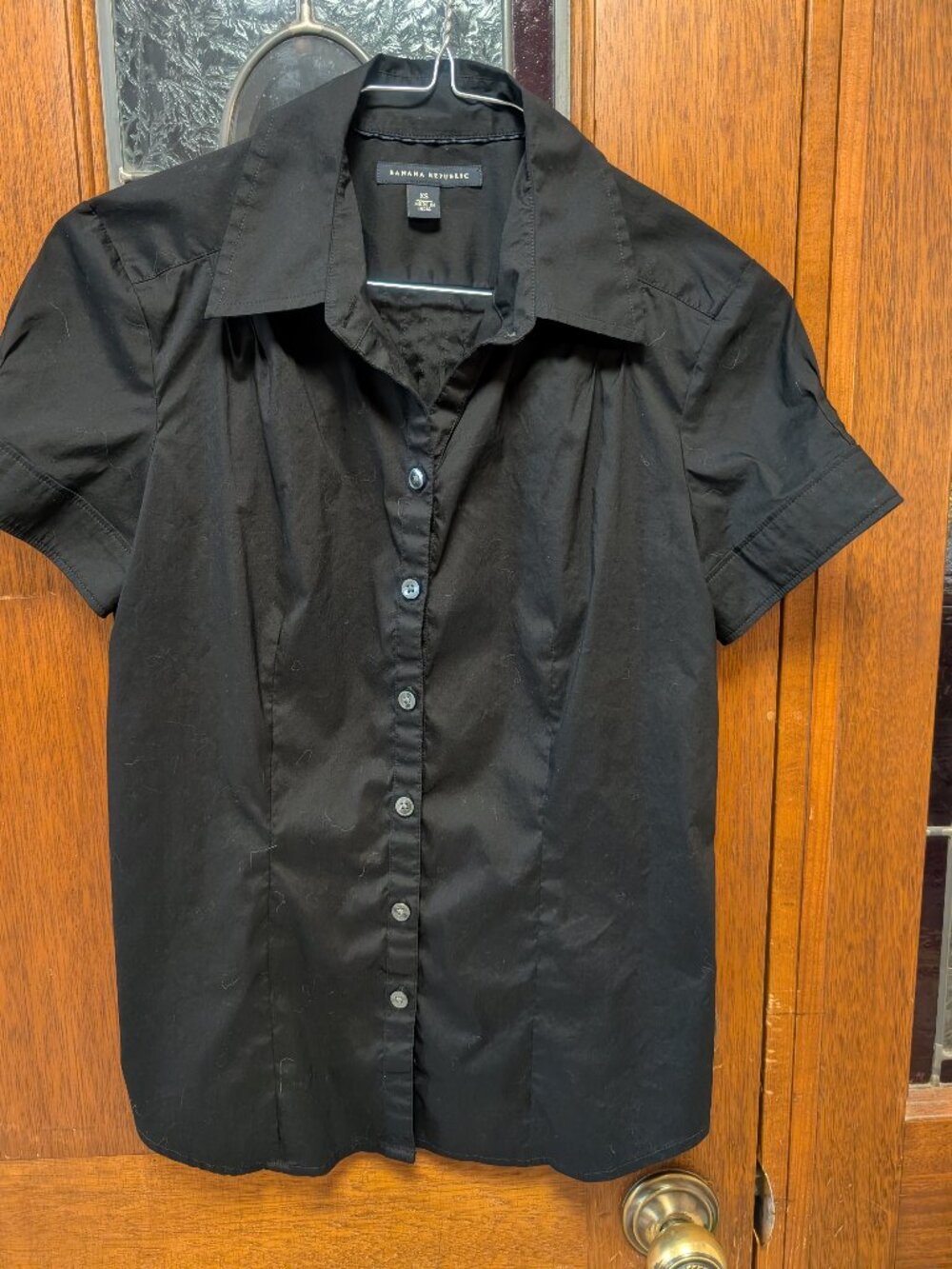Womans black tailored short sleeve top, size XSmall